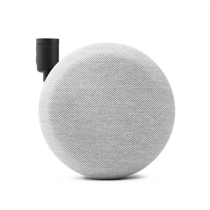 Round gray fabric speaker with black cylindrical component on a white background
