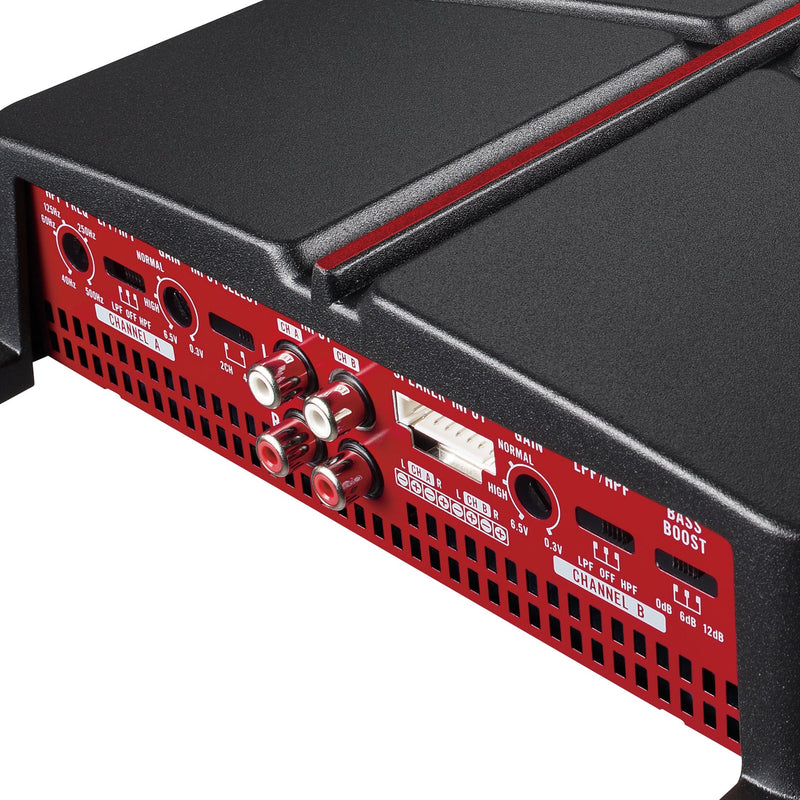 Close-up of a red and black electronic device with control knobs and ports on a white background