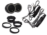 Set of black automotive fog lights with wiring on a white background