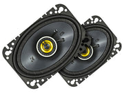 Pair of car speakers with black grills and yellow centers on a white background