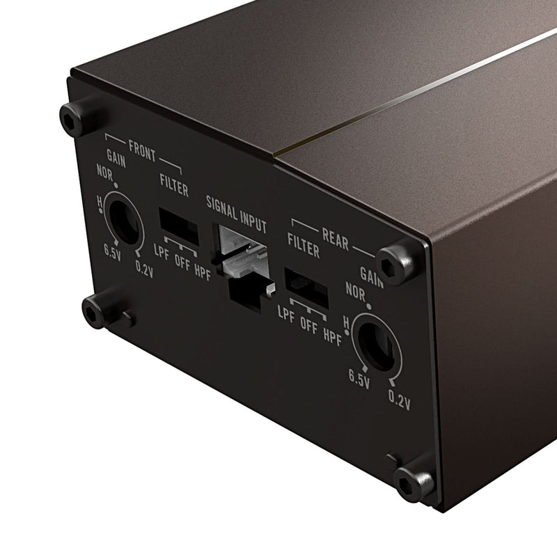 Close-up of the rear panel of a dark brown metal electronic device, showing input and output jacks with labels such as FRONT, SIGNAL INPUT, REAR, and gain settings.