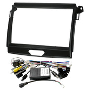 Black double DIN car stereo dashboard console bezel frame kit with wiring harness, RCA connectors, and control module on a white background.