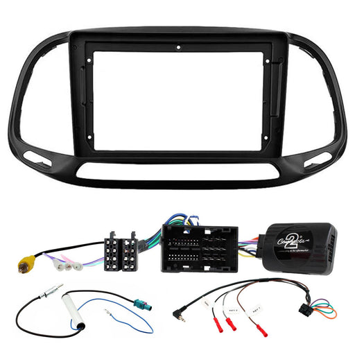 Car stereo dashboard frame kit with wiring harnesses and an electronic control module on a white background.