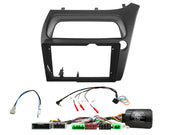 Car stereo dashboard console adapter frame kit with wiring harnesses and connectors on a white background.