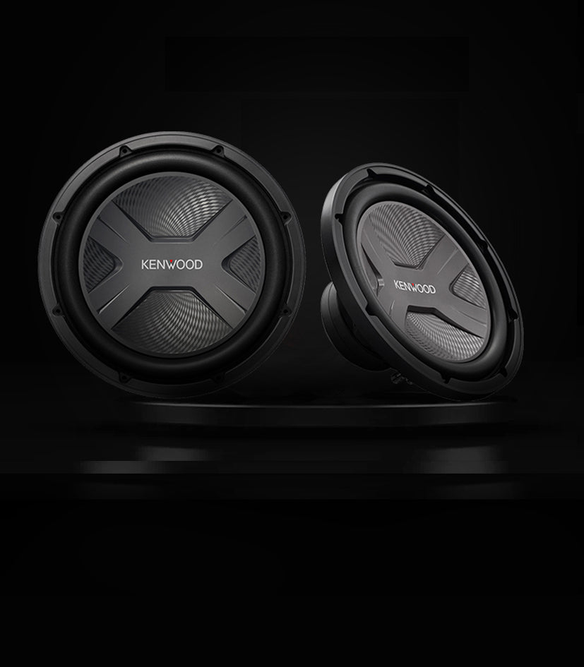 Two Kenwood car subwoofers on a black background