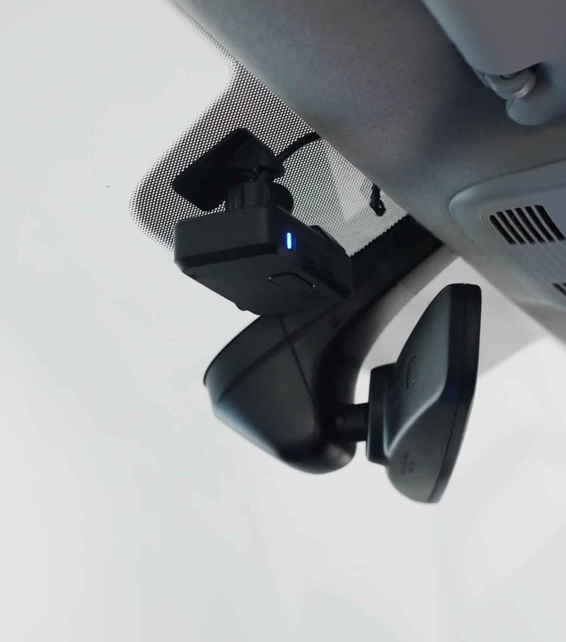 Car dashboard camera mounted on a car's windshield