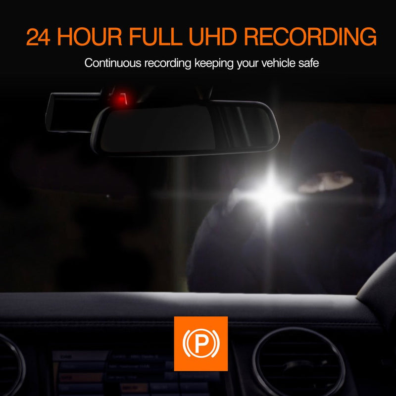 A car rearview mirror device with a red indicator light, shown in a dark car interior with a blurred figure outside at night and bright headlights. Text at the top reads '24 HOUR FULL UHD RECORDING' and an orange square with a white 'P' logo appears at the bottom.