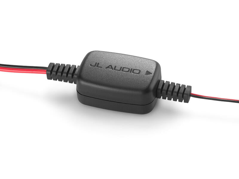 JL Audio electronic component with red and black wires on a white background