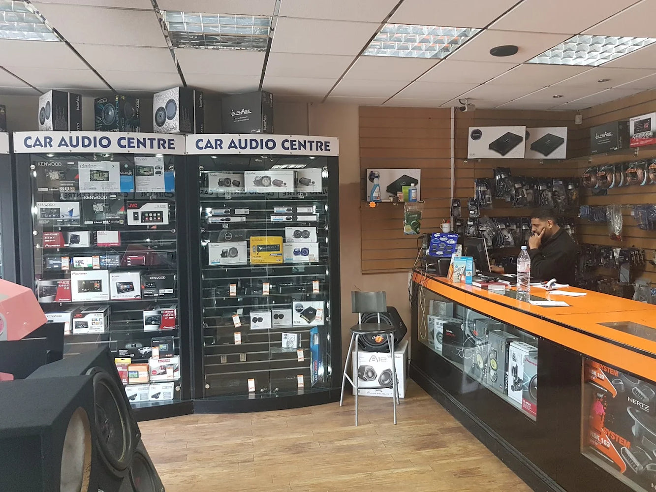 "Car Audio Discount showroom displaying car stereos, speakers, amplifiers, and car audio accessories."