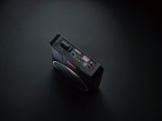 Black portable radio on a dark gray background