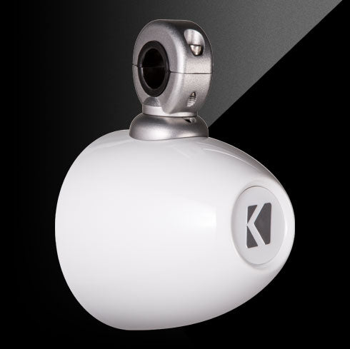 White spherical object with metallic top on a black background