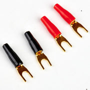 Four wire connectors, two black and two red, on a white background