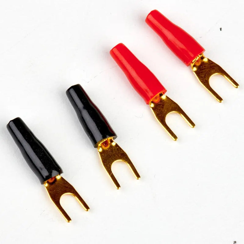 Four wire connectors, two black and two red, on a white background