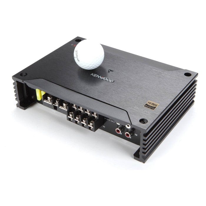 Kenwood amplifier with a golf ball on top against a white background