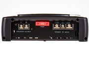 Rear view of a black car audio amplifier or receiver showing speaker output, power input, fuse, and terminal connections on a white background.